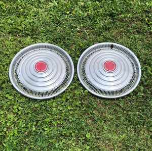 1970-1972 Pontiac Motor Division 15” red center hubcaps pair